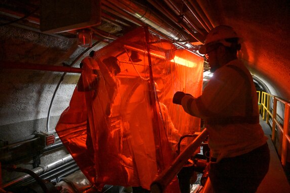 Personnel in support of Joint Task Force-Red Hill (JTF-RH) set up protective curtains prior to cutting into pipe lines at the Red Hill Bulk Fuel Storage Facility (RHBFSF), Halawa, Hawaii, March 11, 2024.