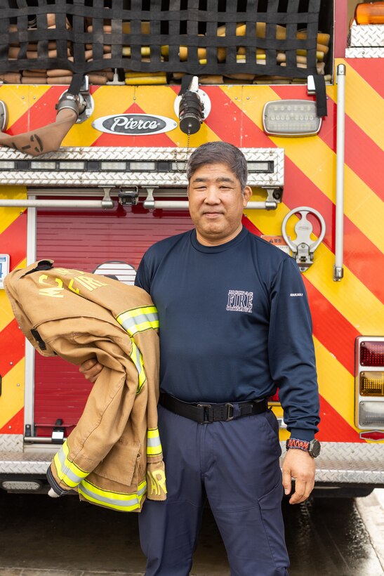 Yoshikazu Arakaki, a fire captain with Marine Corps Installations Pacific Fire and Emergency Services, poses for a portrait on Camp Hansen, Okinawa, Japan, March 5, 2024. Born and raised in Kadena, Okinawa, Japan, Arakaki has been a firefighter for 30 years. Arakaki’s duties as a fire captain include ensuring the personal safety of his team, spearheading daily training, inspections, emergency preparation, supply management, and coordinating his team’s schedules. (U.S. Marine Corps photo by Lance Cpl. Brody Robertson)