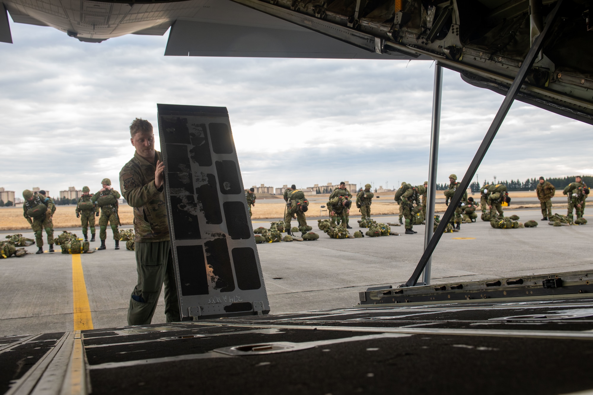 A loadmaster configures a C-130J to load paratroopers for static-line jump training during Airborne 24.