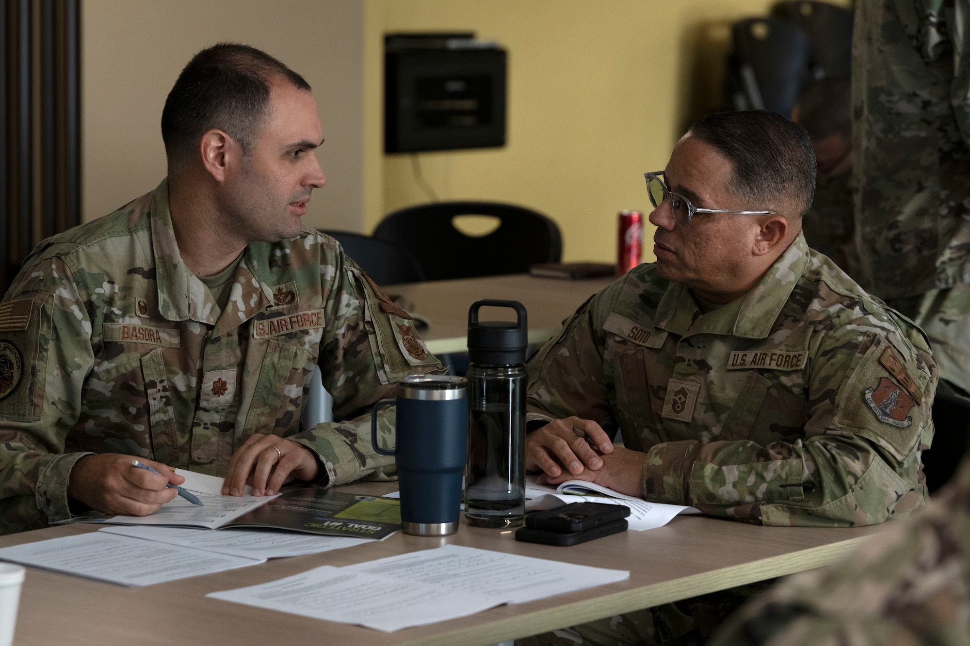 U.S. Air Force Maj. Ricardo Basora Rovira, the 156th Civil Engineering Squadron commander, and Chief Master Sgt. Orlando Soto, the 156th Wing command chief, interact during the Unit Leadership Workshop, at Muñiz Air National Guard Base, Carolina, Puerto Rico, Jan. 25, 2024. The one-day course, developed by the National Guard Bureau Inspector General's office, seeked to address deficiencies identified in unit self-assessment programs and promoted continuous process improvement. (U.S. Air National Guard photo by Airman 1st Class Sharymel Montalvo Velez)