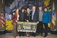 Lt. Col. Jennifer Roberts and her family during her retirement ceremony at the Army Research Laboratory in Adelphi, Md. on Mar. 2, 2024.