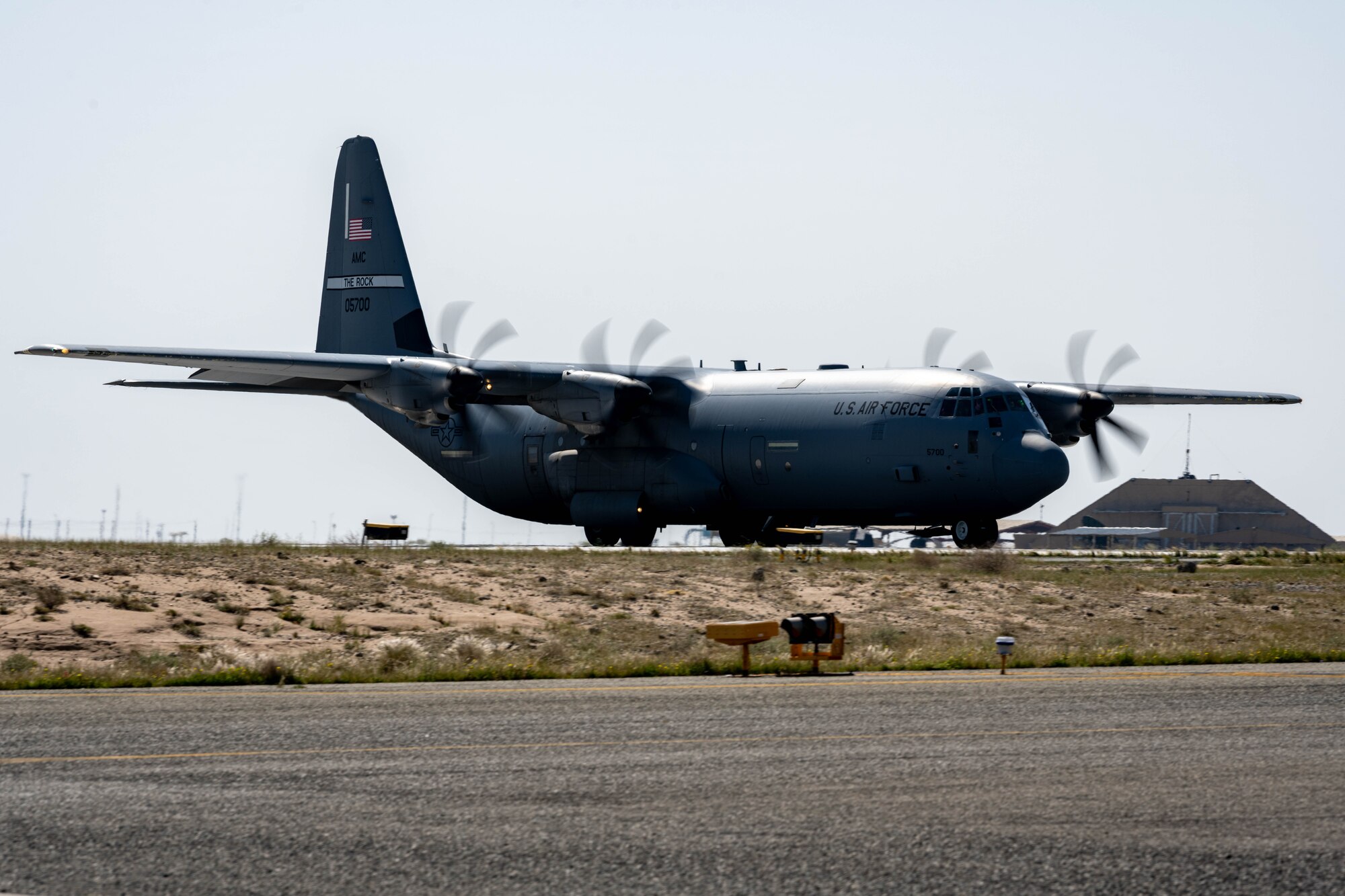 A C-130J loaded with pallets of food and water destined for Gaza via airdrop takes off.