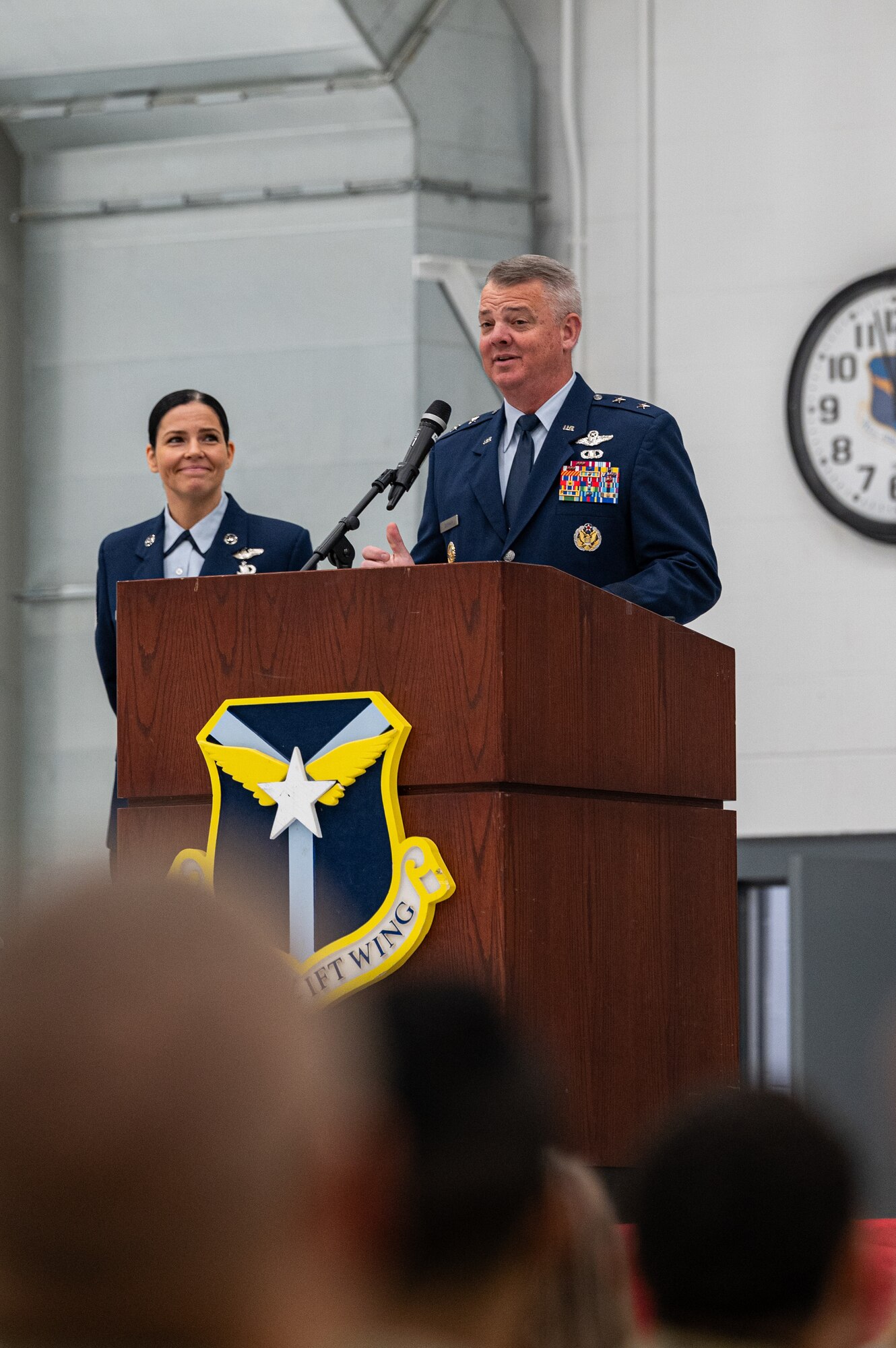 A man in uniform speaking at a podium