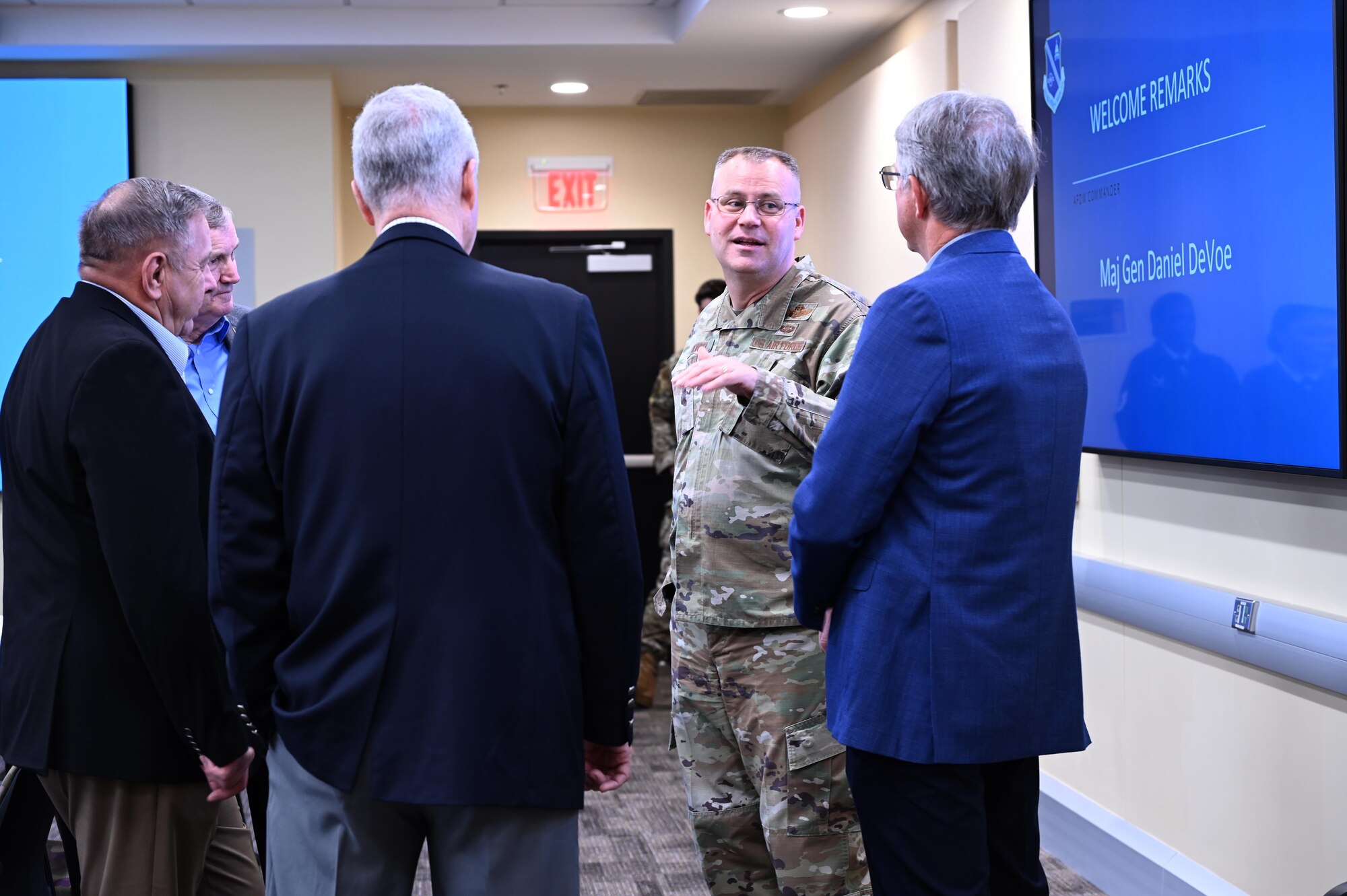 Maj. Gen. Daniel A. DeVoe, commander of the Air Force District of Washington greets former Chief Master Sgts. of the Air Force Eric Benken, Fredrick Finch, Gerald Murray and Rodney McKinley during a Senior Enlisted Statesmen visit hosted by AFDW at Joint Base Andrews, Md., March 7, 2024.
