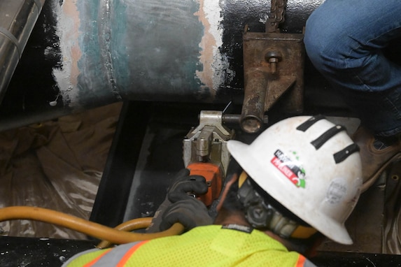 Personnel in support of Joint Task Force-Red Hill (JTF-RH) cut into a pipeline at the Red Hill Bulk Fuel Storage Facility (RHBFSF), Halawa, Hawaii, March 12, 2024