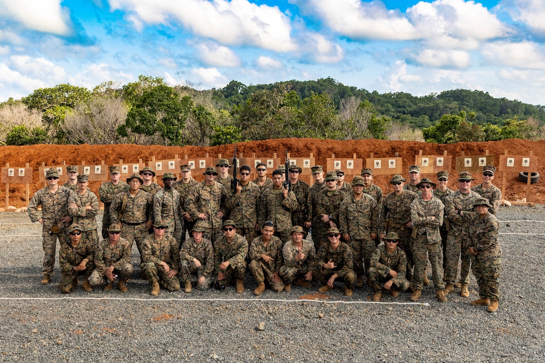 U.S. Marines and Sailors with Task Force Koa Moana 23 pose for a photograph at the conclusion of a range shoot at the Joint Range Complex in Ngatpang, Palau, Sept. 22, 2023. Task Force Koa Moana 23, composed of U.S. Marines and Sailors from I Marine Expeditionary Force, deployed to the Indo-Pacific to strengthen relationships with Pacific Island partners through bilateral and multilateral security cooperation and community engagements. (U.S. Marine Corps photo by Staff Sgt. Courtney G. White)