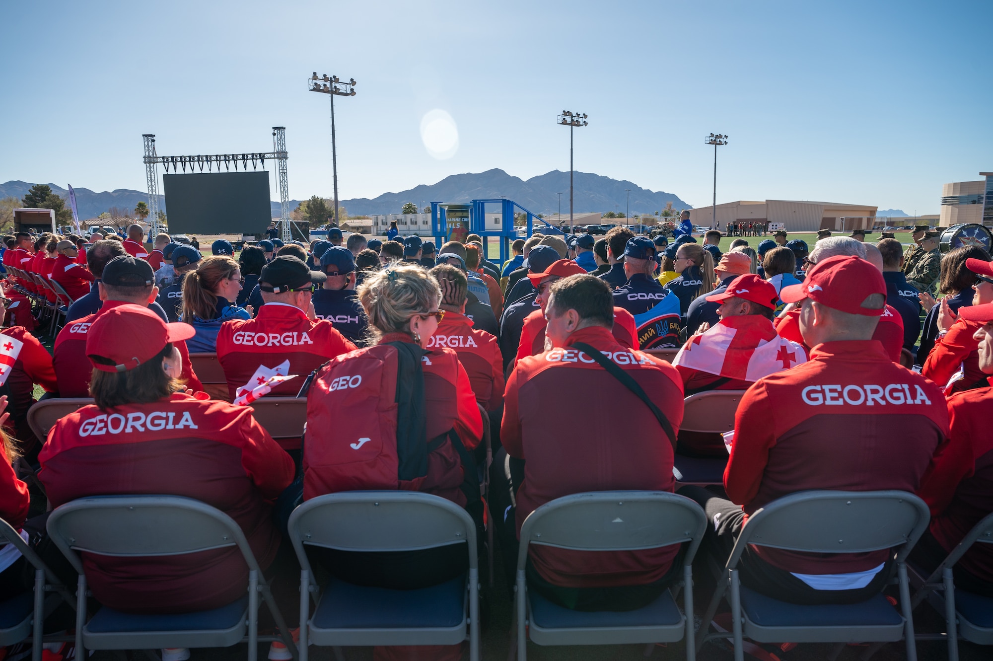 Trial team members from Ukraine and the Republic of Georgia attend the opening ceremony of the 2024 Air Force and Marine Corps trials at Nellis Air Force Base, Nevada, March 8, 2024.
