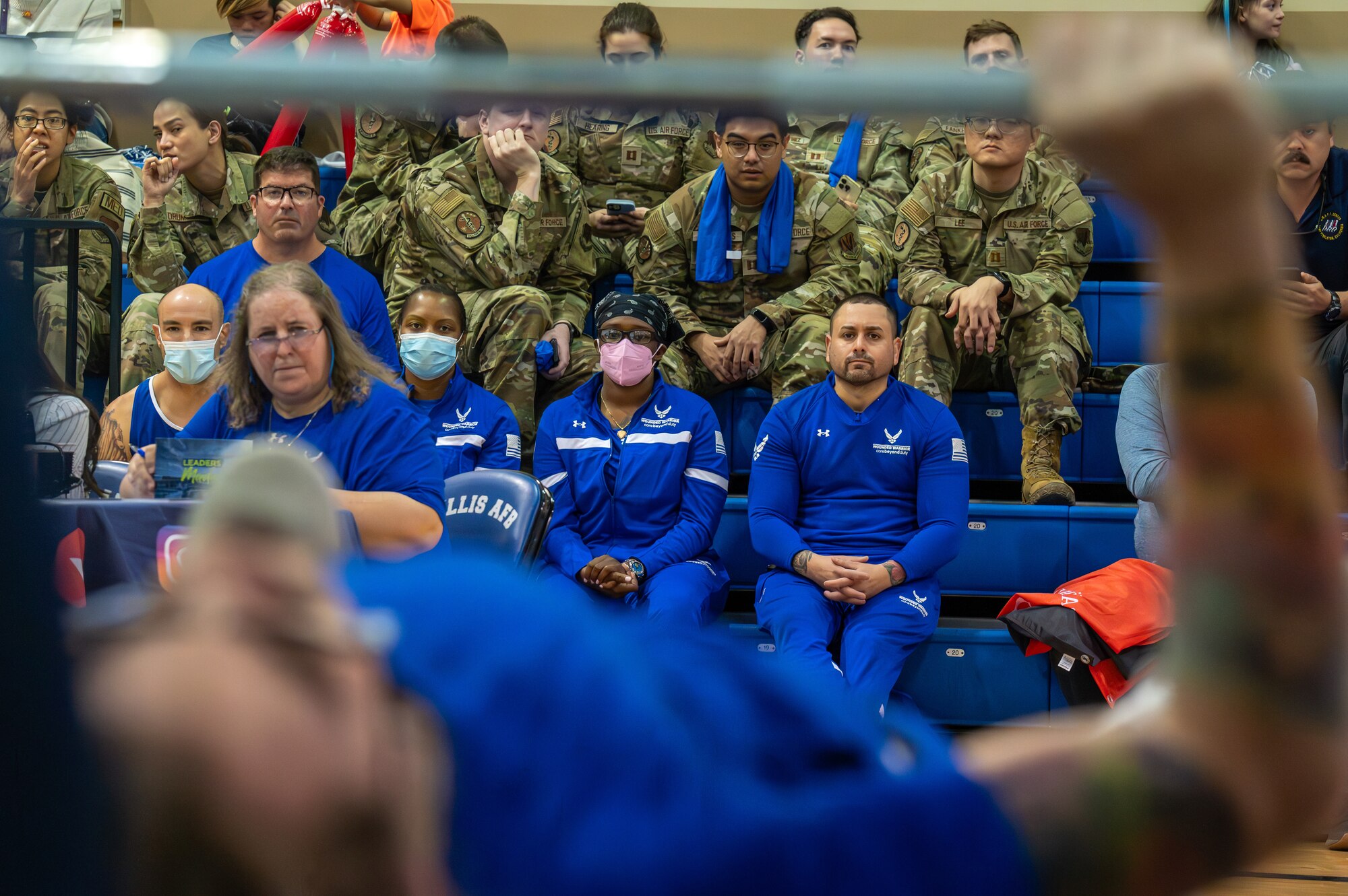 Attendees watch as a member of the U.S. Air Force team competes in the 2024 Air Force and Marine Corps powerlifting competition at Nellis Air Force Base, Nevada, March 8, 2024.