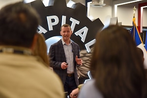 Col. Elliott Leigh, AFWERX director and chief commercialization officer for the Department of the Air Force, helps cut the ribbon to celebrate the official opening of The Joint Defense Innovation Space at Capital Factory during South by Southwest in Austin, Texas, March 8, 2024.