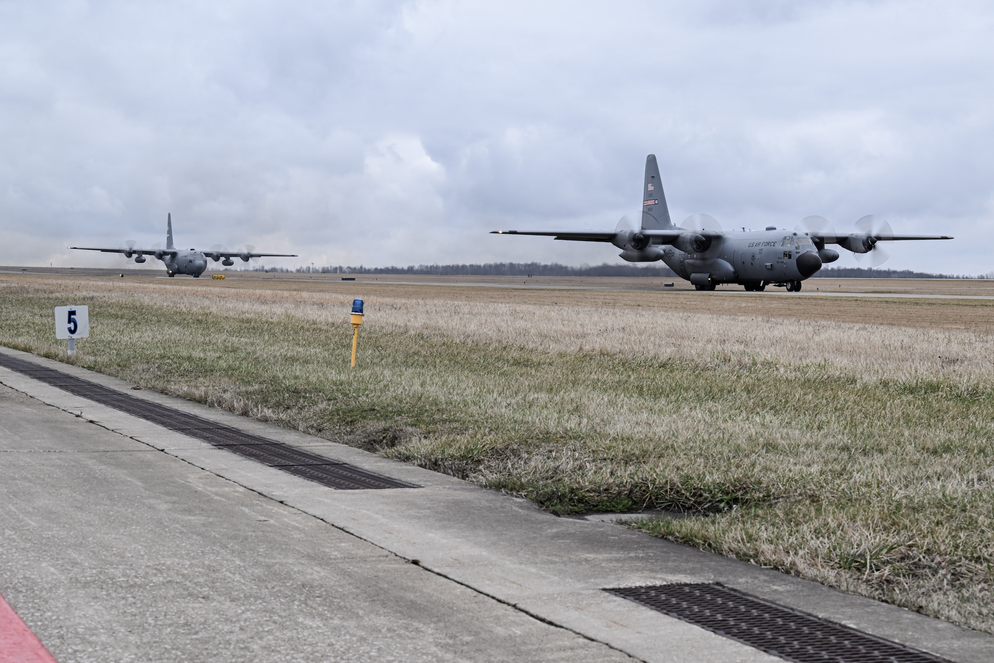 Two C-130H Hercules aircraft assigned to the 757th Airlift Squadron taxi down the flightline at Youngstown Air Reserve Station, Ohio, March 3, 2024.