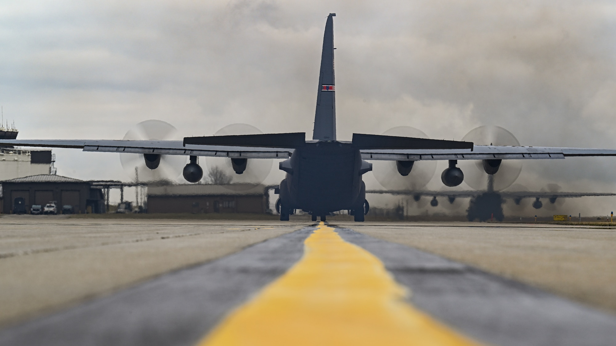 Two C-130H Hercules aircraft assigned to the 757th Airlift Squadron taxi down the flightline at Youngstown Air Reserve Station, Ohio, March 3, 2024.