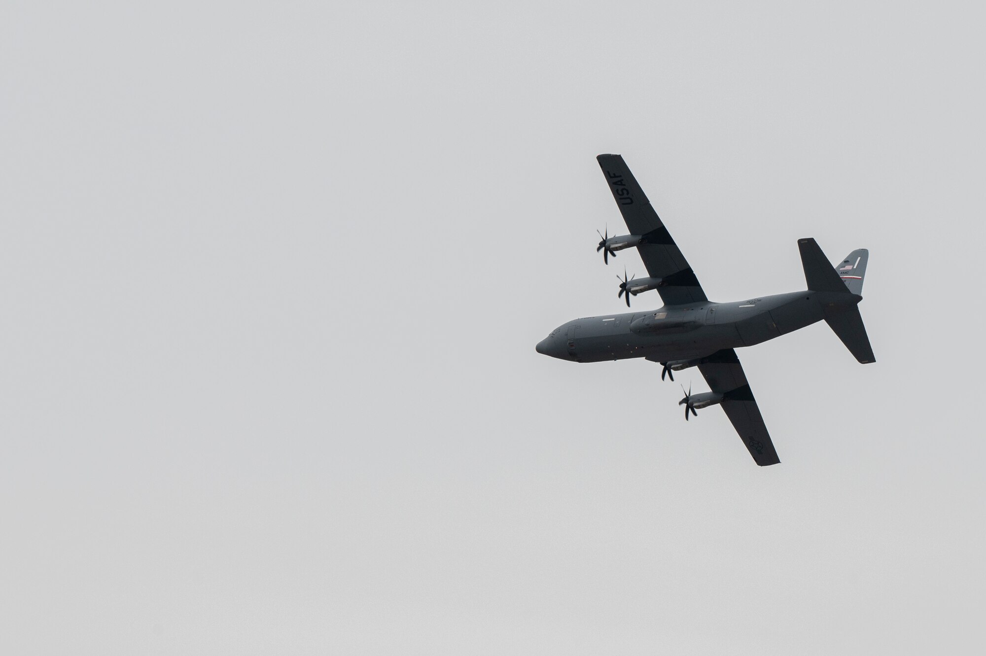 A C-130J Super Hercules flies over Dyess Air Force Base, Texas, Mar. 1, 2024, during the Hazard Dawn readiness exercise. The 317th Airlift Wing developed and executed a readiness exercise designed to evaluate mission essential tasks, testing the wing’s ability to generate, employ and sustain tactical airlift against the most consequential threat scenario. (U.S. Air Force photo by Airman 1st Class Emma Anderson)