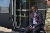 U.S. Ambassador to Jamaica, Nick Perry, sits on an MH-60M Black Hawk helicopter assigned to the 160th Special Operations Aviation Regiment, at Kingston, Jamaica, Feb. 28, 2024.