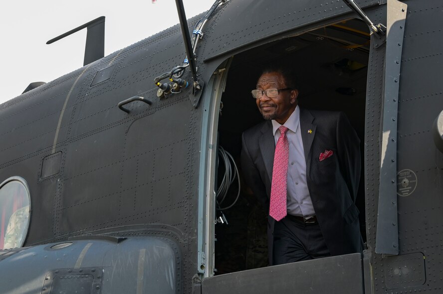U.S. Ambassador to Jamaica, Nick Perry, looks out of a MH-47G Chinook helicopter assigned to the 160th Special Operations Aviation Regiment, at Kingston, Jamaica, Feb. 28, 2024.