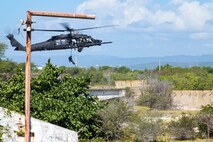 U.S. Army Soldiers assigned to the 7th Special Forces Group rappel from an MH-60M Black Hawk helicopter during exercise Tropical Dagger at Kingston, Jamaica, Feb. 28, 2024.