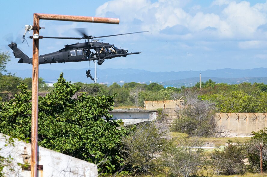 U.S. Army Soldiers assigned to the 7th Special Forces Group rappel from an MH-60M Black Hawk helicopter during exercise Tropical Dagger at Kingston, Jamaica, Feb. 28, 2024.