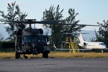 U.S. Army Soldiers assigned to the 7th Special Forces Group conduct landing procedures on an MH-60M Black Hawk helicopter, assigned to the 160th Special Operations Aviation Regiment, during exercise Tropical Dagger at Kingston, Jamaica, Feb. 22, 2024.