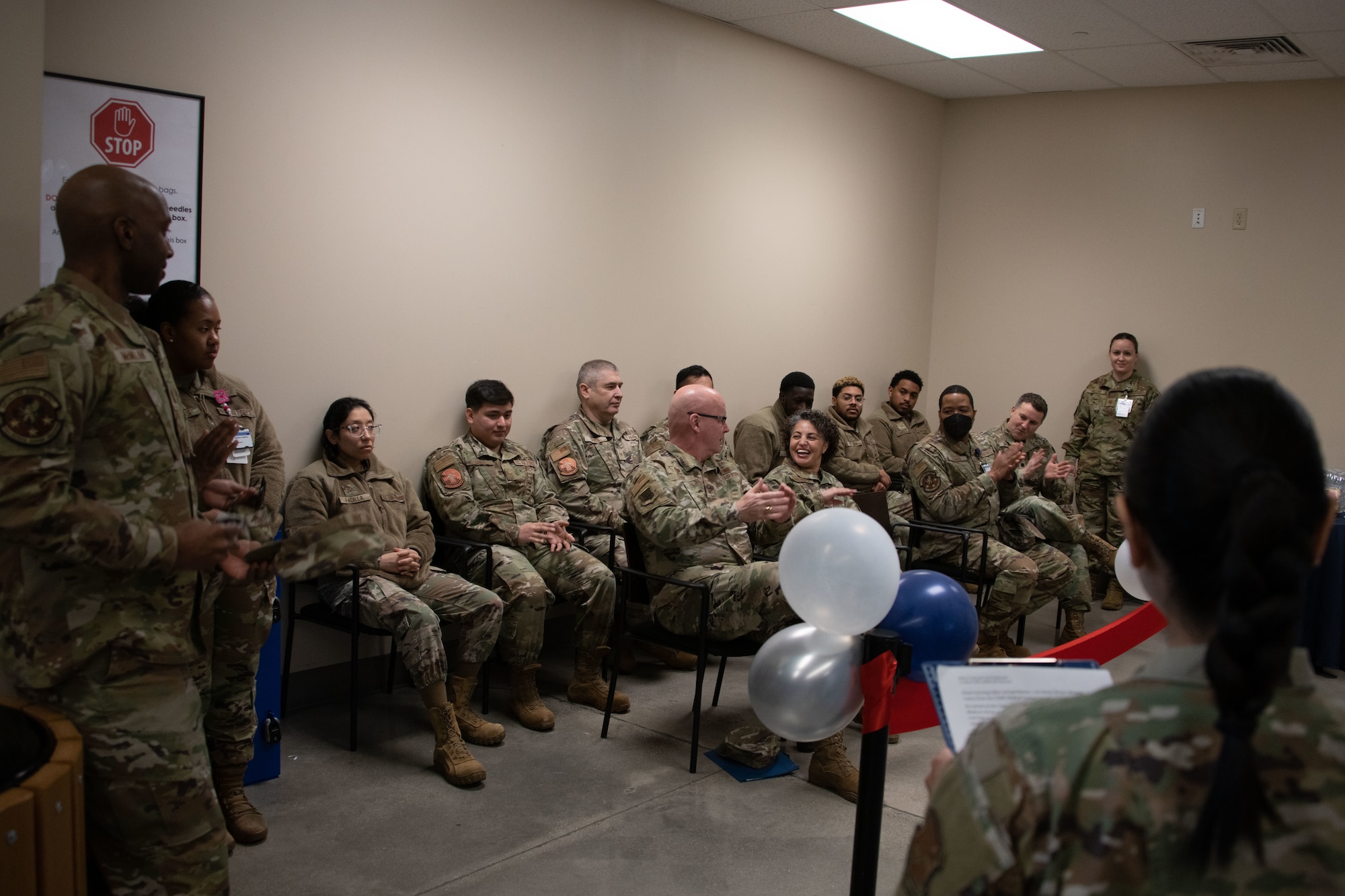 Military members clap during the ScriptCenter ribbon cutting ceremony at Joint Base Andrews, Md., March 11, 2024.