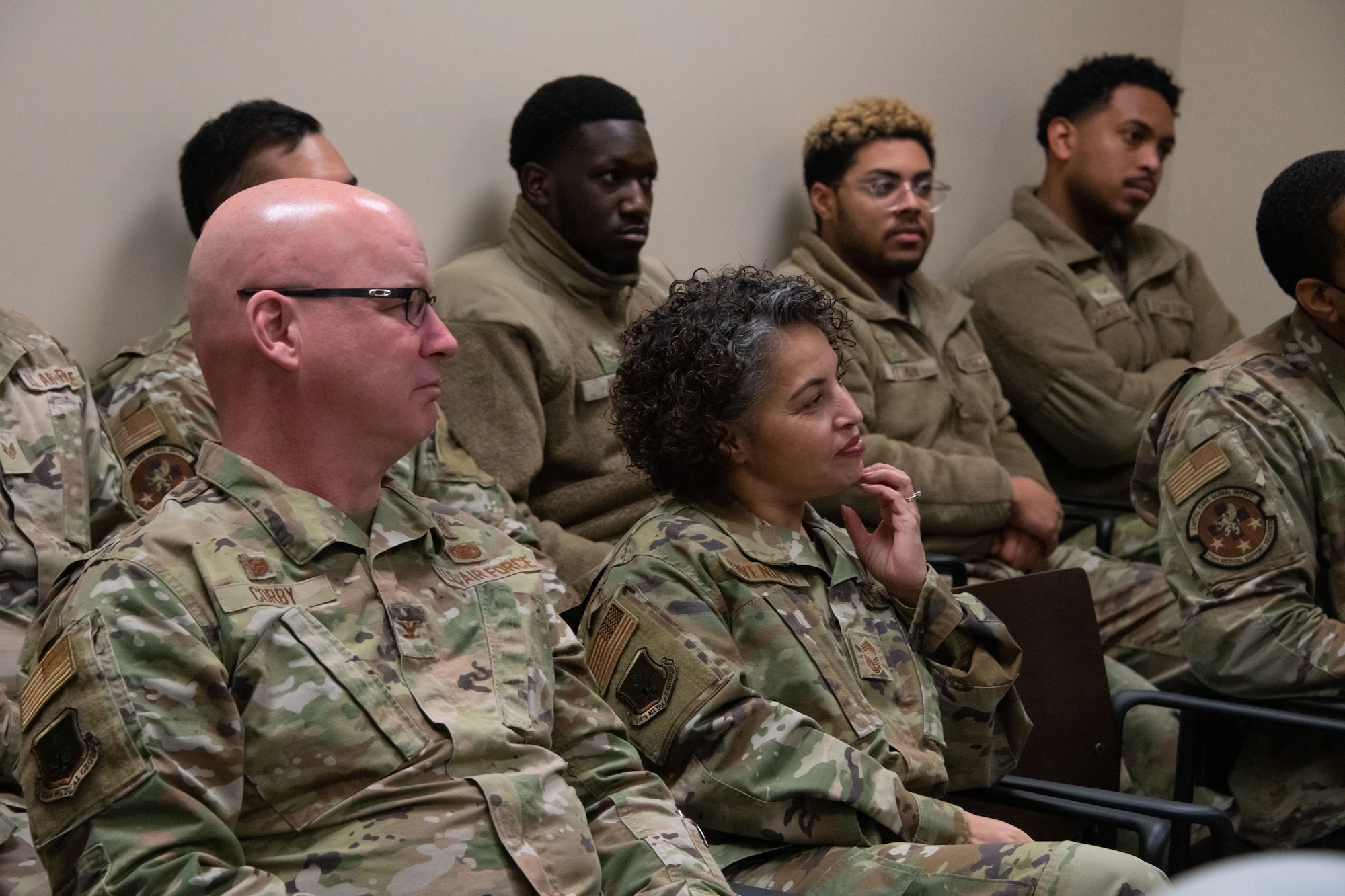 Military members listen to announcements during the ScriptCenter ribbon cutting ceremony at Joint Base Andrews, Md., March 11, 2024.