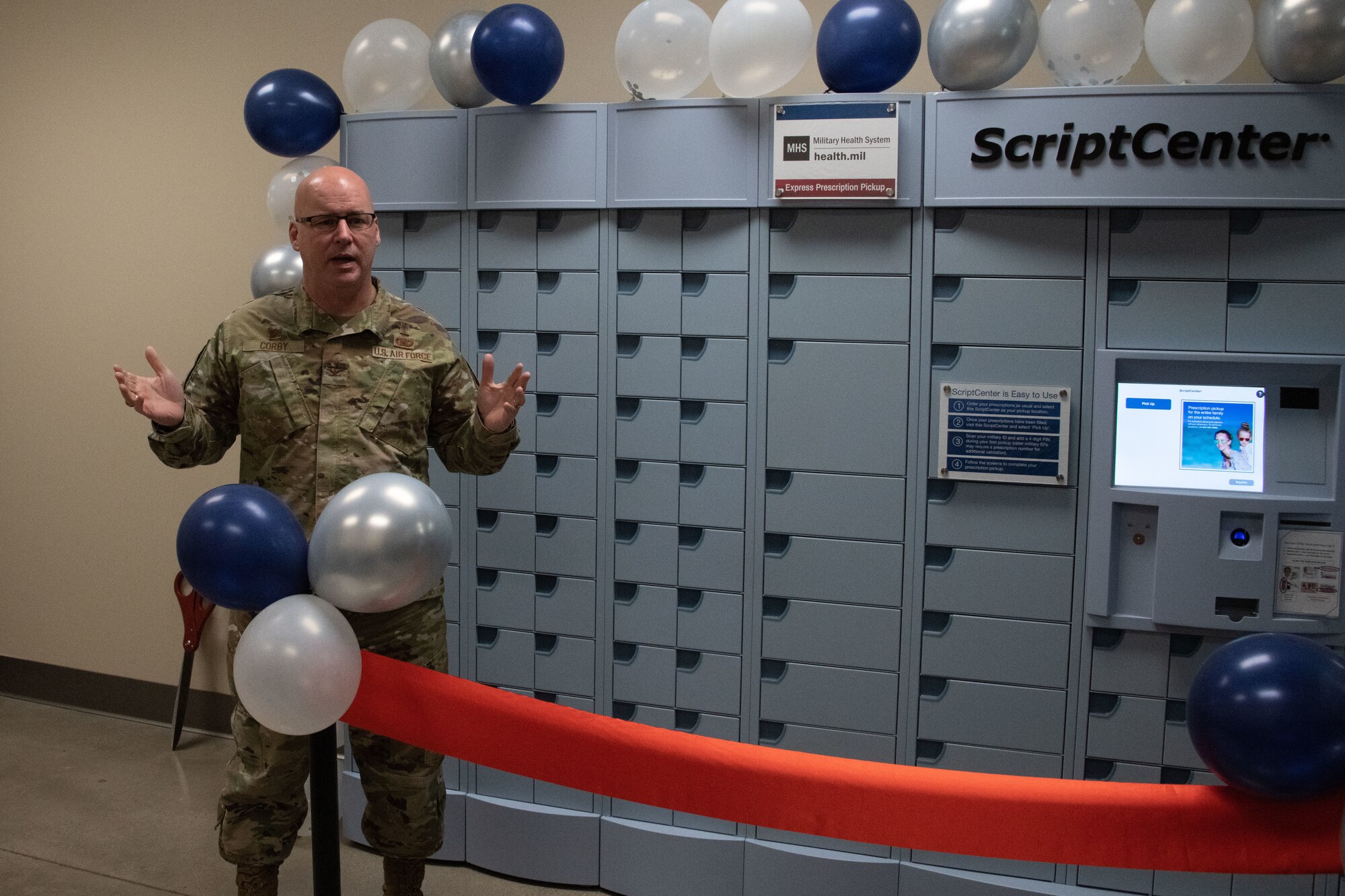 U.S. Air Force Col. Robert Corby, 316th Medical Group commander, gives a speech during the ScriptCenter ribbon cutting ceremony at Joint Base Andrews, Md., March 11, 2024.