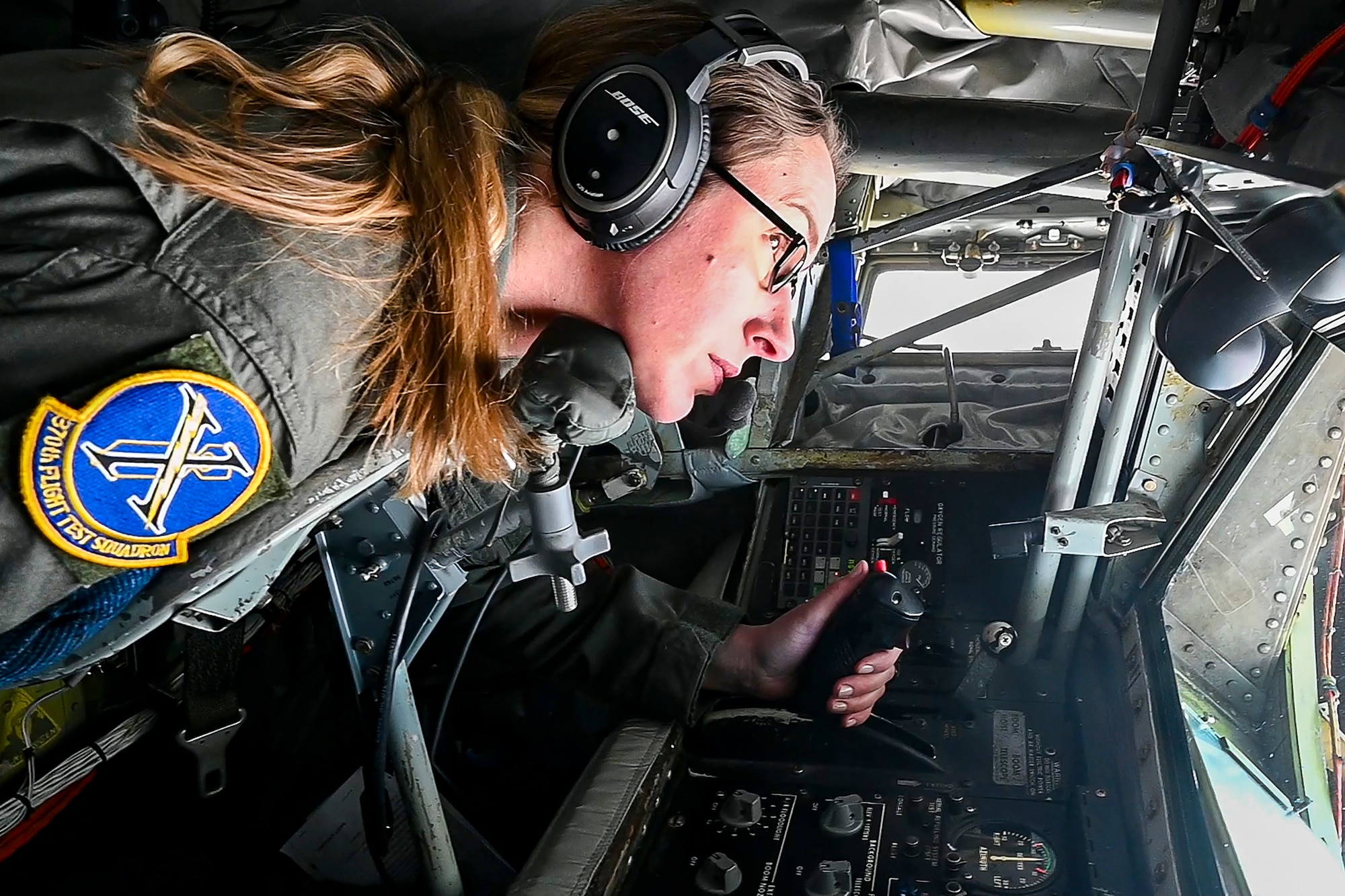 Master Sgt. Brittany Garland, an aerial refueling boom operator with the 370th Flight Test Squadron, stays on the lookout for approaching aircraft while conducting aerial refueling operations in the skies above Edwards Air Force Base, California, Jan. 22, 2024. (Air Force photo by Laisa Leao)