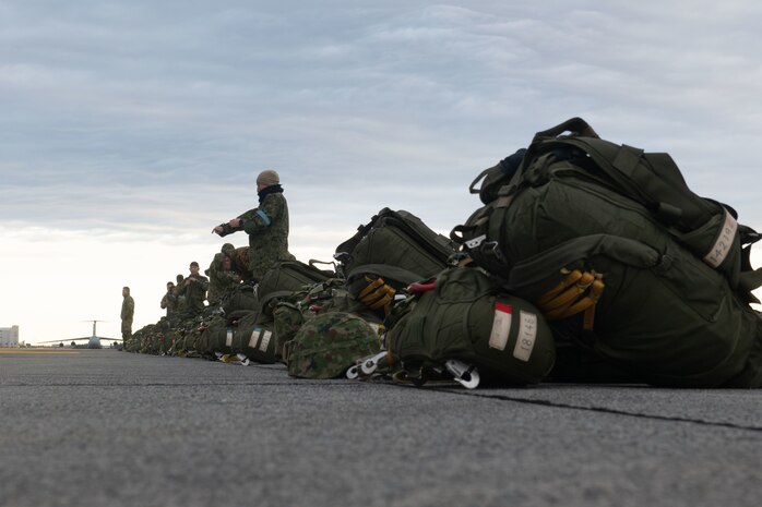 Paratroopers prepare to load onto a C-130J for static-line jump training during Airborne 24