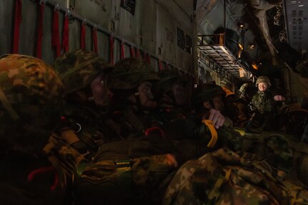 Paratroopers wait for further instruction inside of a C-130J during Airborne 24.