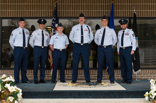 U.S. Space Force Sgt. Thomas Davenport, 533rd Training Squadron, Detachment 1 noncommissioned officer in-charge of Guardian Development, center, poses for a photo with Space Delta 1 leadership following his graduation from Military Training Leader School at Keesler Air Force Base, Miss., Feb. 29, 2024. Davenport is the first Space Force Guardian to graduate from MTLS and be certified as an MTL. (U.S. Air Force photo by Senior Airman Trenten A. Walters)