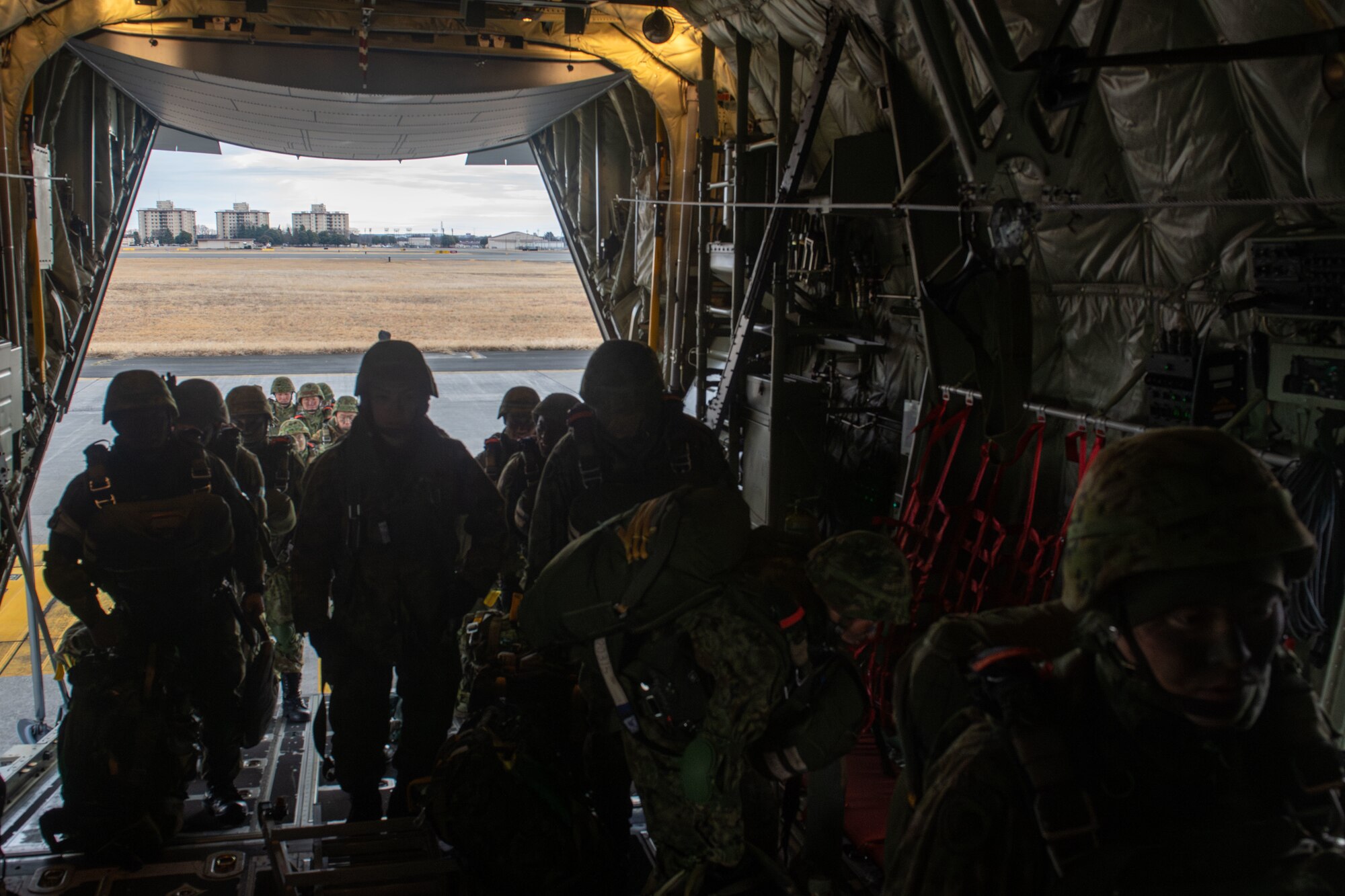 Paratroopers load onto a C-130J for static-line jump training during Airborne 24.