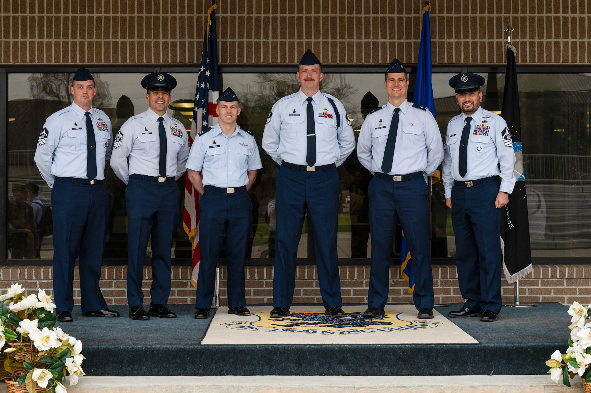 U.S. Space Force Sgt. Thomas Davenport, 533rd Training Squadron, Detachment 1 noncommissioned officer in-charge of Guardian Development, center, poses for a photo with Space Delta 1 leadership following his graduation from Military Training Leader School at Keesler Air Force Base, Miss., Feb. 29, 2024. Davenport is the first Space Force Guardian to graduate from MTLS and be certified as an MTL. (U.S. Air Force photo by Senior Airman Trenten A. Walters)