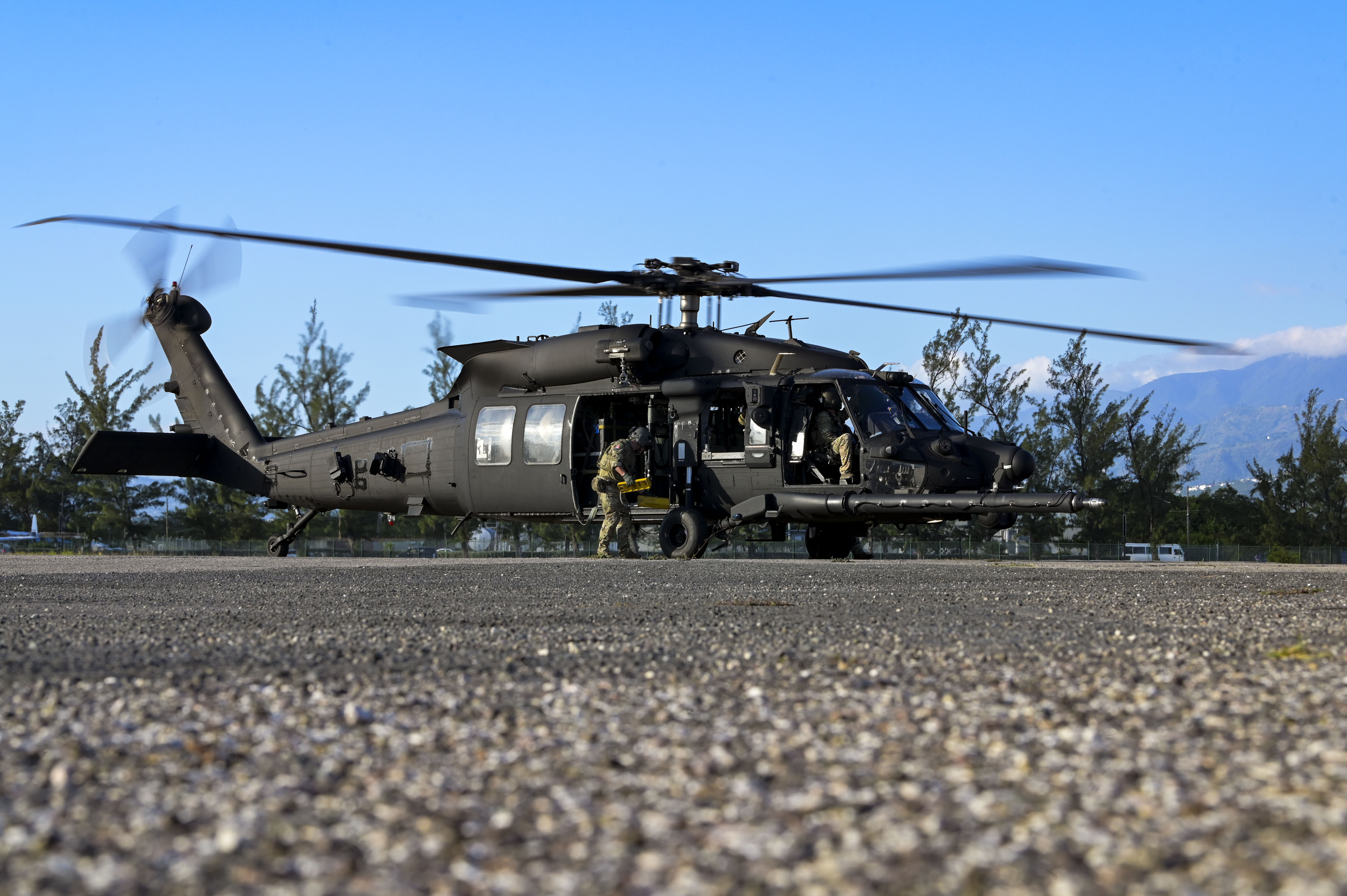 U.S. Army Soldiers assigned to the 7th Special Forces Group conduct landing procedures on an MH-60M Black Hawk helicopter, assigned to the 160th Special Operations Aviation Regiment, during exercise Tropical Dagger at Kingston, Jamaica, Feb. 22, 2024.
