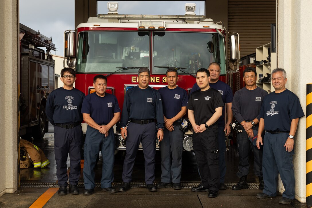 Firefighters with Marine Corps Installations Pacific Fire and Emergency Services pose for a group photo on Camp Hansen, Okinawa, Japan, March 5, 2024. Born and raised in Kadena, Okinawa, Japan, Yoshikazu Arakaki, a fire captain with MCIPAC F&ES, has been a firefighter for 30 years. Arakaki’s duties as a fire captain include ensuring the personal safety of his team, spearheading daily training, inspections, emergency preparation, supply management, and coordinating his team’s schedules. (U.S. Marine Corps photo by Lance Cpl. Brody Robertson)