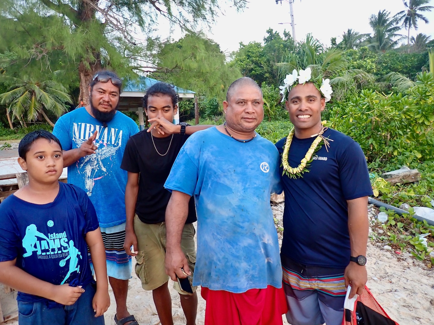 Petty Officer 2nd Class Eugene Halishlius, originally from Yap, stands with family during a visit to Ulithi Atoll on Feb. 21, 2024. The USCGC Frederick Hatch (1143) crew completed a significant operational patrol under Operation Rematau from Feb. 15 to March 4, 2024, reinforcing the U.S. Coast Guard's commitment to maritime safety, security, and environmental stewardship in the Pacific region. (U.S. Coast Guard photo)