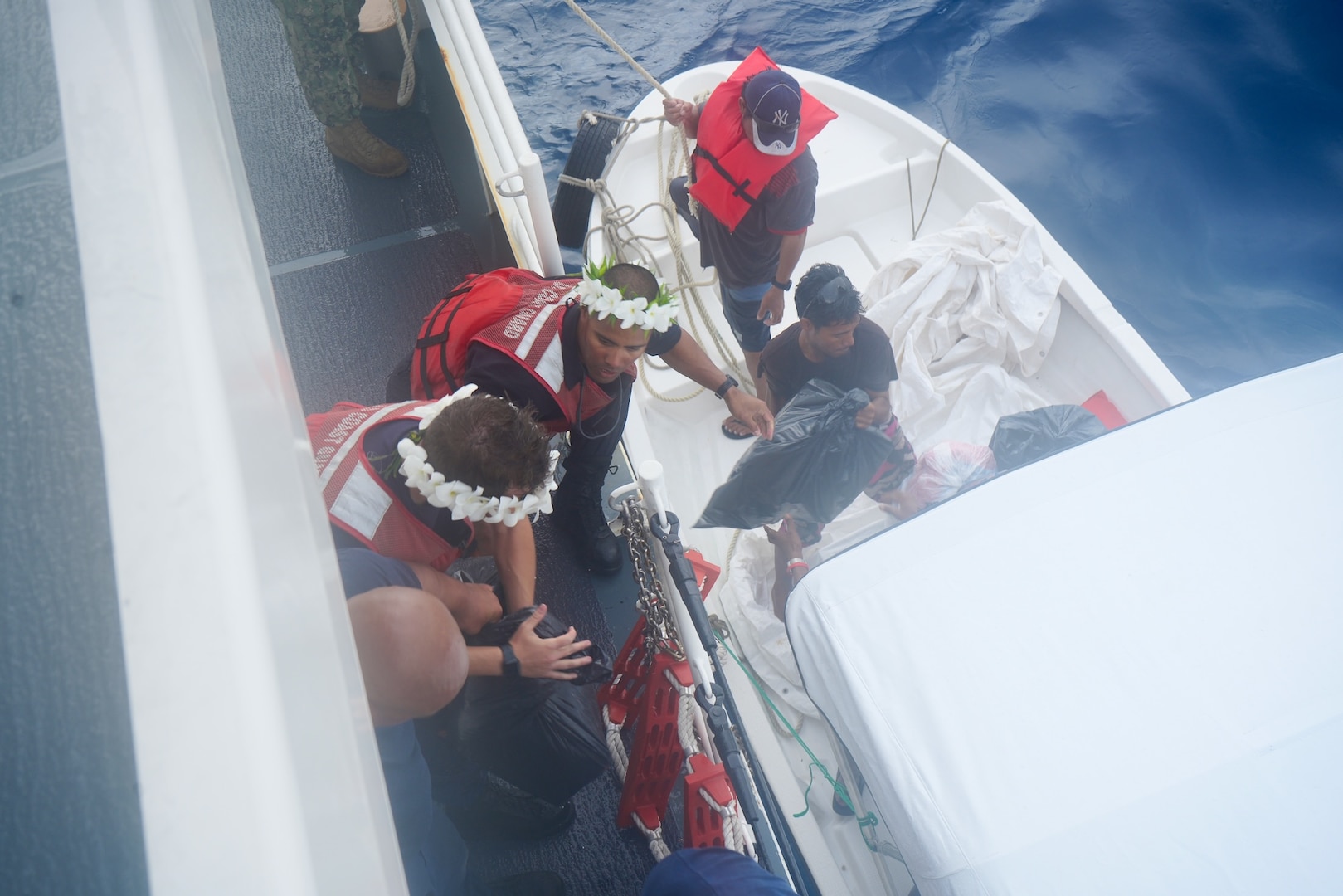 The crew of the USCGC Frederick Hatch (WPC 1143) deliver 1,500 lbs. of non-perishable food, 1,200 lbs. of water, and essential supplies, including fishing gear and tools, for Ulithi Atoll, FSM, during a state-declared emergency drought on Feb. 21, 2024. The crew completed a significant operational patrol under Operation Rematau from Feb. 15 to March 4, 2024, reinforcing the U.S. Coast Guard's commitment to maritime safety, security, and environmental stewardship in the Pacific region. (U.S. Coast Guard photo)