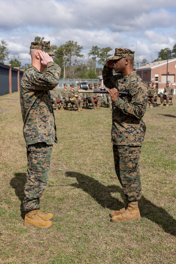 U.S. Marine Corps Master Gunnery Sgt. Eddie W. Dowdell III, right, outgoing sergeant major of 2nd Network Battalion, renders a salute to Lt. Col. Andrew S. Walker, commanding officer, 2nd Network Battalion, during a relief and appointment ceremony on Marine Corps Base Camp Lejeune, North Carolina, March 8, 2024. Dowdell relinquished his post as the senior enlisted advisor to Sgt. Maj. Casey S. Chandler, incoming sergeant major of 2nd Network Battalion. (U.S. Marine Corps photo by Lance Cpl. Alyssa J. Deputee)