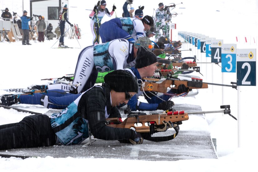 Staff Sgt. Kristin Milford, Pennsylvania National Guard, prepares her firearm for the shooting portion of the Pursuit Race at the 50th anniversary Chief of the National Guard Bureau Biathlon Championships at Soldier Hollow Nordic Center, Feb. 18, 2024. The Utah National Guard hosted the national biathlon competition consisting of cross-country skiing and competitive shooting events that test the warriors’ endurance and marksmanship. (U.S. Army Photo by Staff Sgt. William Cowley)