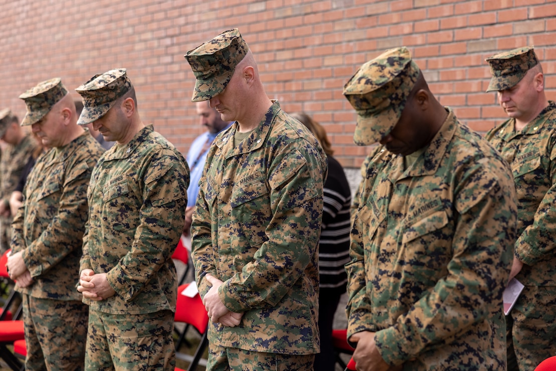 U.S. Marine Leaders with 2nd Network Battalion bow their heads during the invocation as a relief and appointment ceremony begins on Marine Corps Base Camp Lejeune, North Carolina, March 8, 2024.