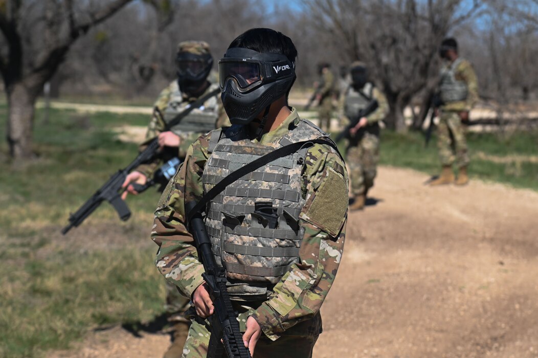 Cadets from Angelo State University Air Force ROTC participate in a visual signals training exercise as part of an annual field training exercise where they are expected to sharpen their leadership skills at Goodfellow Air Force Base, Texas, March 1, 2023. Cadets practiced expeditionary skills with paintball guns as part of the field training exercise. (U.S. Air Force Photo by Airman James Salellas)