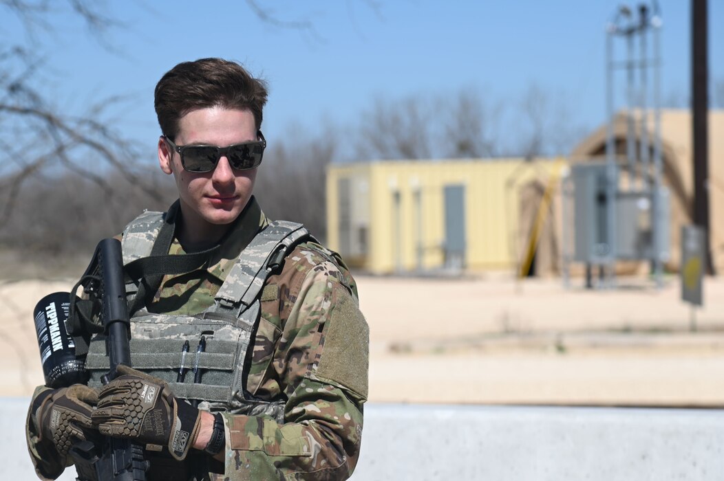 Cadet from Angelo State University Air Force ROTC stands as he awaits further instructions at Goodfellow Air Force Base, March 1, 2023. Cadets operated in a simulated environment where they learned tactics on how to spot an Improvised Explosive Device and how to facilitate entry control points. (U.S. Air Force photo by Airman James Salellas)