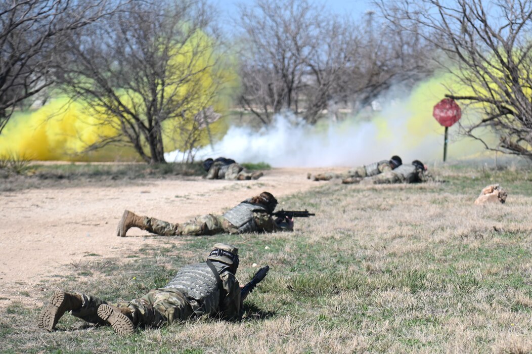 Angelo State University ROTC cadets lay down in a prone position as they defend from a simulated enemy fire during an annual field training exercise at Goodfellow Air Force Base, March 1, 2024. The cadets put their leadership skills to the test as they face an array of difficult situations. (U.S. Air Force photo by Airman James Salellas)