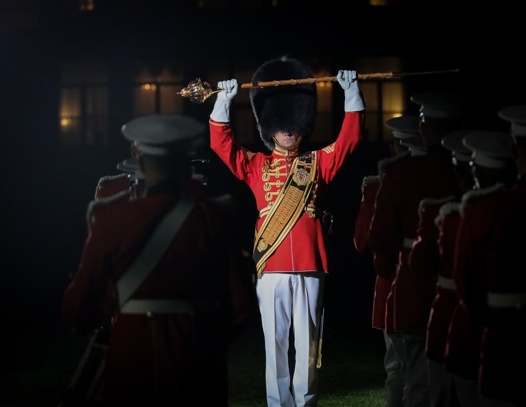 Master Gunnery Sergeant Duane F. King, Drum Major, with the “President's Own” United States Marine Band, leads the band during a Friday Evening Parade at Marine Barracks Washington, D.C., May 19, 2023. The 38th Commandant of the United States Marine Corps, Gen. David H. Berger, was the hosting official and the guests of honor were the Rear Admiral Carey H. Cash, 21st Chaplain of the United States Marine Corps, Rabbi Arnold Resnicoff, retired Navy Chaplain, Reverend Dianna Pohlman-Bell, retired Navy Chaplain, Dr. Mae Pouget, Chaplain Parham’s daughter, and Dr. Thomas Parham III, Chaplain Parham’s son. (U.S. Marine Corps photo by LCpl. Pranav Ramakrishna)