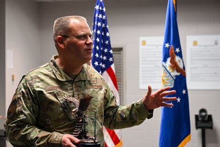 U.S. Air Force Maj. Gen. Daniel A. DeVoe, Air Force District of Washington and 320th Air Expeditionary Wing commander, addresses Airmen during the AFDW Outstanding Security Forces individual awards presentation at the 11th Security Forces Squadron on Joint Base Anacostia-Bolling, Washington, D.C., March 12, 2024. Four Defenders stationed on JBAB were recognized by DeVoe for their significant contributions to the installation, mission and Security Forces as a whole.