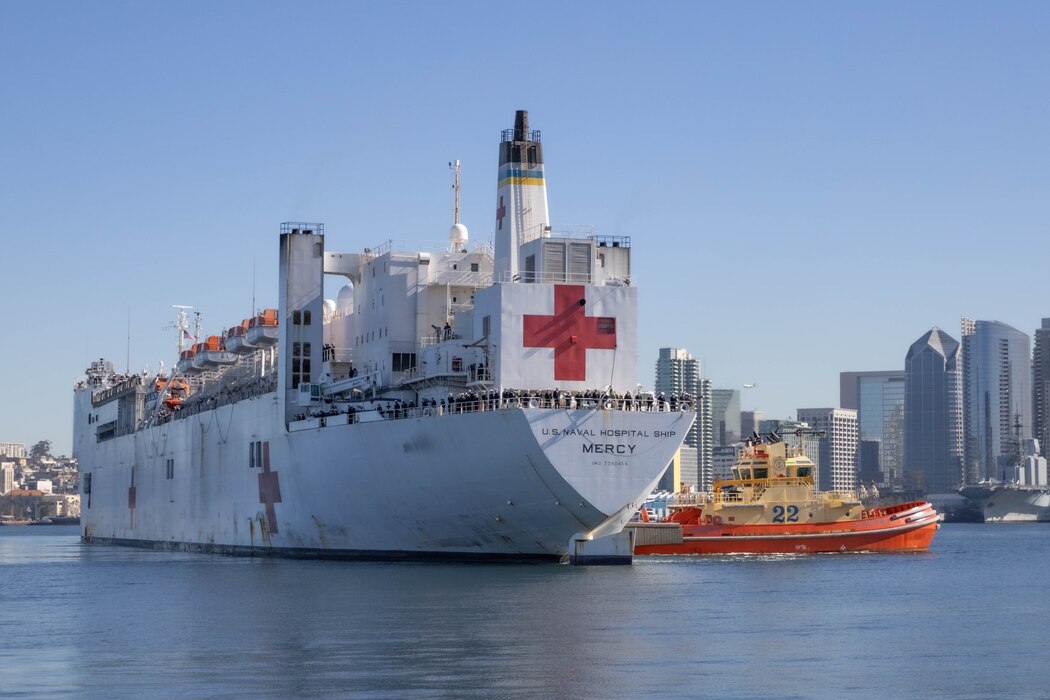 240212-N-YN807-1122 SAN DIEGO (Feb 12, 2024) –  Hospital ship USNS Mercy (T-AH 19) returns to homeport at Naval Air Station North Island (NASNI) in San Diego after completing a deployment in support of Pacific Partnership 2024. Pacific Partnership, now in its 19th iteration, is the largest multinational humanitarian assistance and disaster relief preparedness mission conducted in the Indo-Pacific and works to enhance regional interoperability and disaster response capabilities, increase security stability in the region, and foster new and enduring friendships. (U.S. Navy photo by Mass Communication Specialist 2nd Class Megan Alexander)