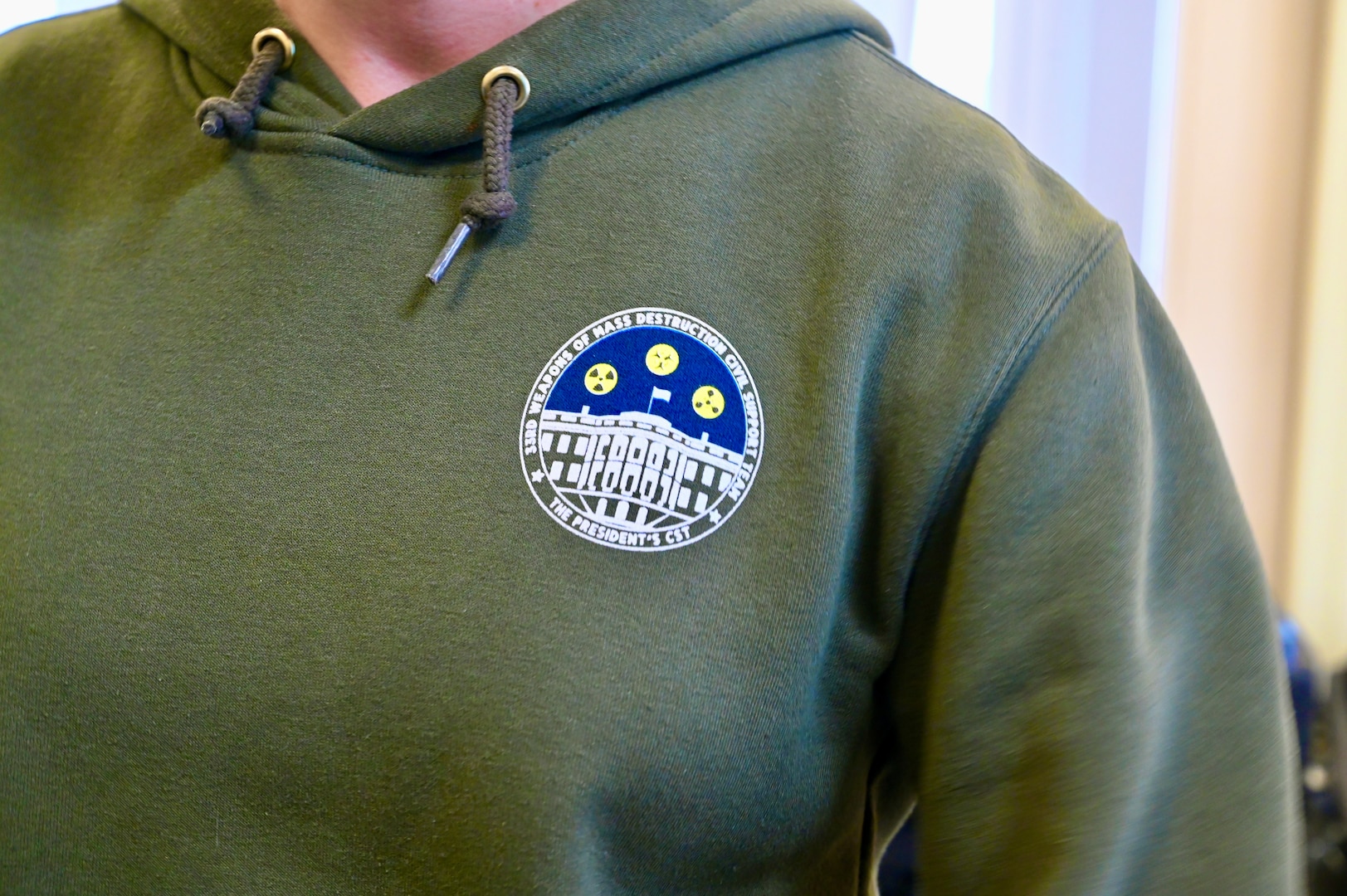 U.S. Army Staff Sgt. Chasity Townsend, administration noncommissioned officer, 33rd WMD-CST, wears a sweatshirt that bears the symbol associated with being ‘The President’s CST,' at the D.C. Armory, March 7, 2024.  The 33rd WMD-CST was strategically positioned to respond effectively with D.C. Fire, U.S. Secret Service, U.S. Capitol Police, and CBRNE Enhanced Response Force Packages (CERFP) units.