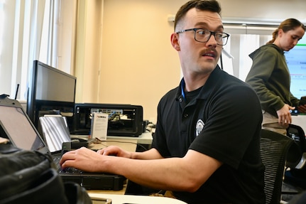 U.S. Air Force Tech. Sgt. James P. Hargraves, operations noncommissioned officer/GIS modeler, 33rd Civil Support Team, tracks personnel and checks their statuses at the D.C. Armory, March 7, 2024.  The joint operation center was the center for operations during the mobilization for the State of the Union Address.