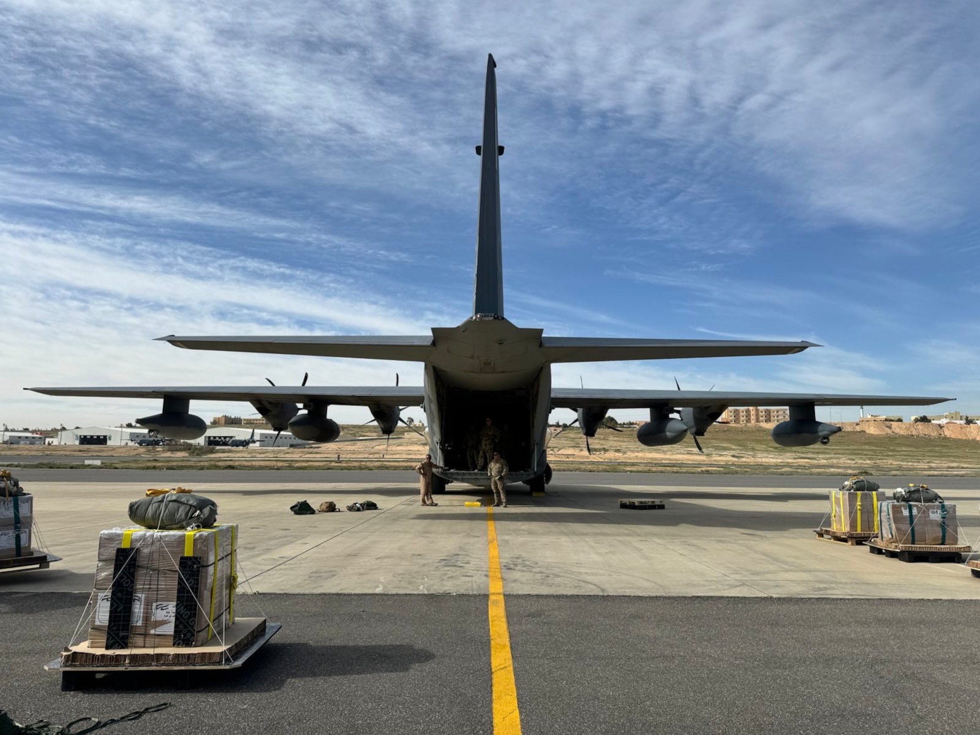 Airmen load humanitarian aid destined for airdrop over Gaza.