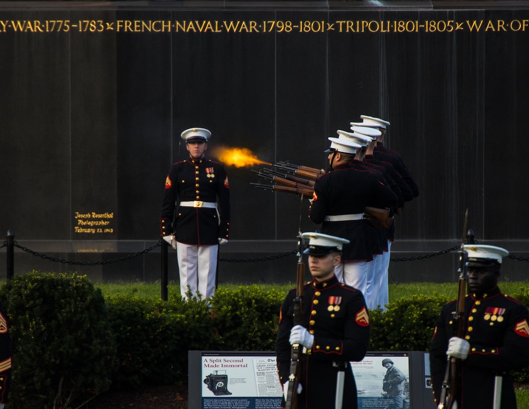 A firing party with Bravo Company, Marine Barracks Washington, fires a volley during a Sunset Parade at the Marine Corps War Memorial, Arlington, Va., July 19, 2022. The hosting official for the evening was Lt. Gen. Edward D. Banta, Deputy Commandant, Installation and Logistics, and the guest of honor was The Honorable Debbie Wasserman Schultz, Representative for Florida's 23rd Congressional District. (U.S. Marine Corps photo by LCpl. Pranav Ramakrishna)
