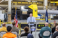 Mike Jepson, operations director, Shop 31, Inside Machinist, at Puget Sound Naval Shipyard & Intermediate Maintenance Facility, describes what the new propulsion shaft lathe will mean to the Navy and PSNS & IMF in the years to come, during a dedication ceremony Feb. 26, 2024, in Bremerton, Washington, for a new propulsion shaft lathe, honoring Special Warfare Operator 1st Class (Navy SEAL) Patrick D. Feeks, who was killed in Afghanistan Aug. 16, 2012. (U.S. Navy photo by Jeb Fach)