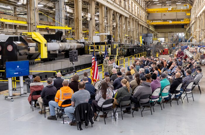 Capt. JD Crinklaw, commander, Puget Sound Naval Shipyard & Intermediate Maintenance Facility in Bremerton, Washington, delivers remarks, Feb. 26, 2024, during a dedication ceremony for a new propulsion shaft lathe, honoring Special Warfare Operator 1st Class (Navy SEAL) Patrick D. Feeks, who was killed in Afghanistan Aug. 16, 2012. (U.S Navy photo by Wendy Hallmark)