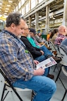 Brian McCoy, safety advocate, Shop 31, Inside Machinist, at Puget Sound Naval Shipyard & Intermediate Maintenance Facility in Bremerton, Washington, reads a tribute to Special Warfare Operator 1st Class (Navy SEAL) Patrick D. Feeks, who died in Afghanistan in 2012. (U.S. Navy photo by Wendy Hallmark)